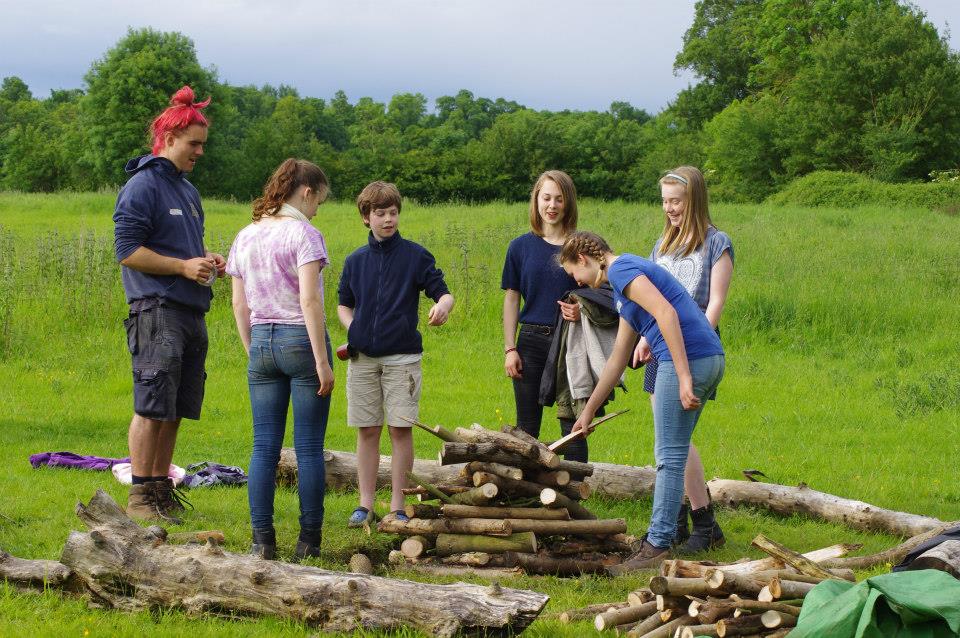 A group of Venturers building a campfire