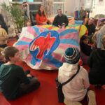 Circle time around the tent made at 100 Objects Cudham residential