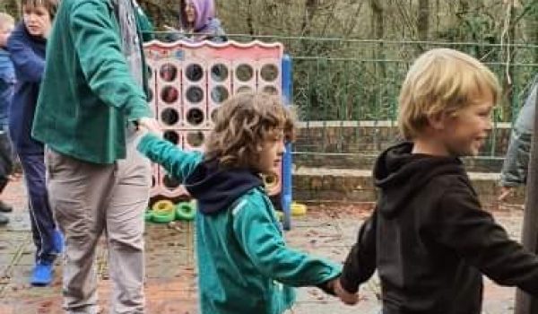 children holding hands and playing a game